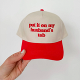Put It On My Husbands Tab Trucker Hat - Red