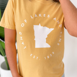 Land of Lakes and Pines Mustard Tee